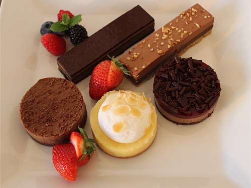 3498 - Selection of Quality desserts to include Lemon Meringue, Opera Cake, Chocolate Entrement, Chocolate Moca Mousse and Black Forest Raspberry Cake